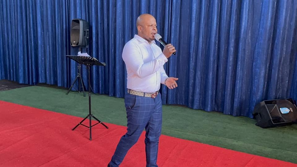 Prophet Matimba Nyandane sharing the Word with a microphone during ministry